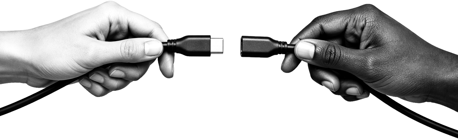 Two hands from different people holding the ends of a cable, plugs almost touching
