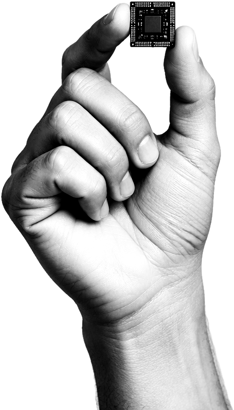 A hand holding a microchip