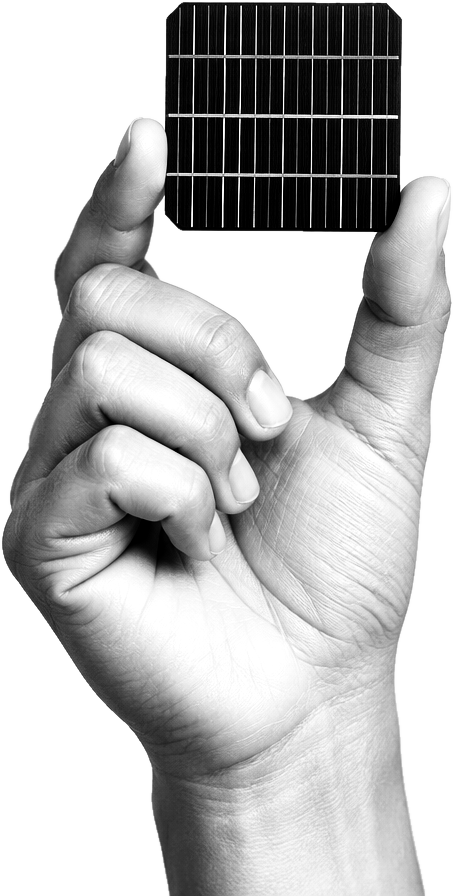 A hand holding a photovoltaic solar cell